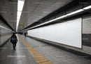 Modern Subway Tunnel with Tiled Walls and Ceiling Lights