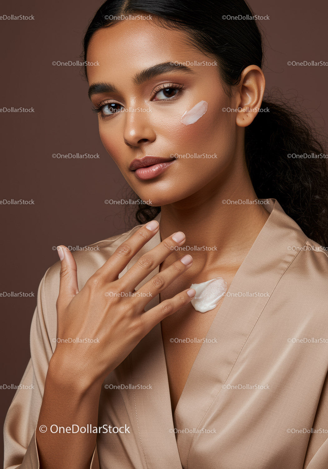 Elegant Woman Applying Facial Cream for Skincare Routine