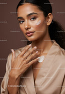 Elegant Woman Applying Facial Cream for Skincare Routine