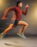 Athletic woman sprinting in dynamic studio light