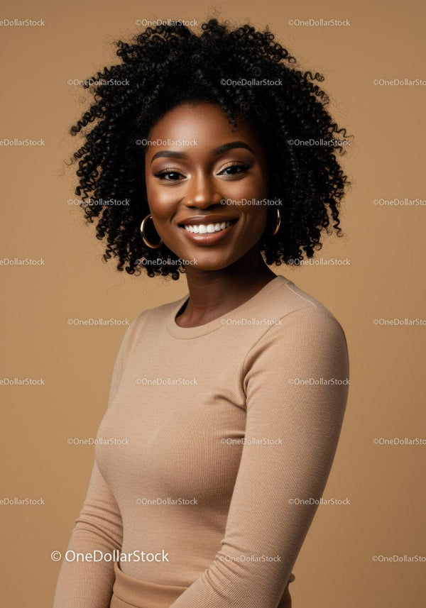 Portrait of a Smiling Black Woman with Curly Hair in Beige Top
