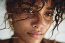 Close-up of a Woman with Water Droplets and Intense Gaze