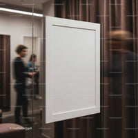 Blank white canvas hanging in modern gallery space
