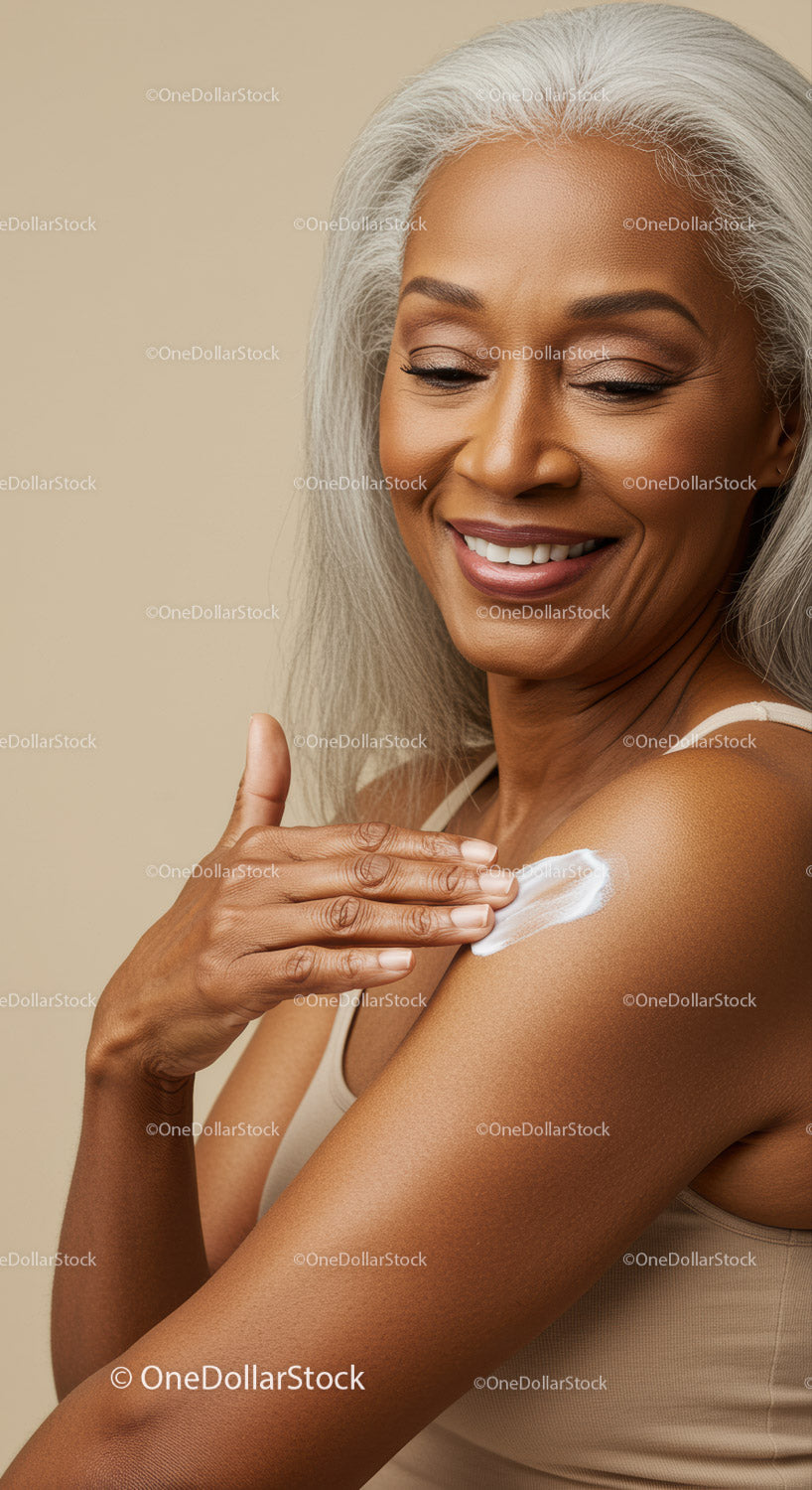 Beautiful Elderly Woman Applying Skincare Lotion with a Radiant Smile