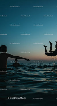 Playful Moments in the Water at Sunset
