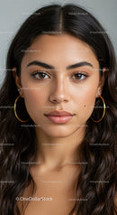 Portrait of a Young Woman with Brown Hair and Natural Makeup