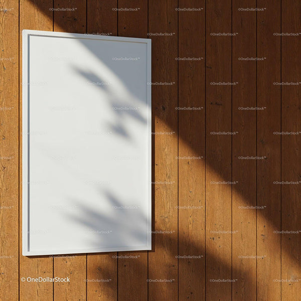 Blank white poster on wooden wall with natural shadows JPG Mockup Image