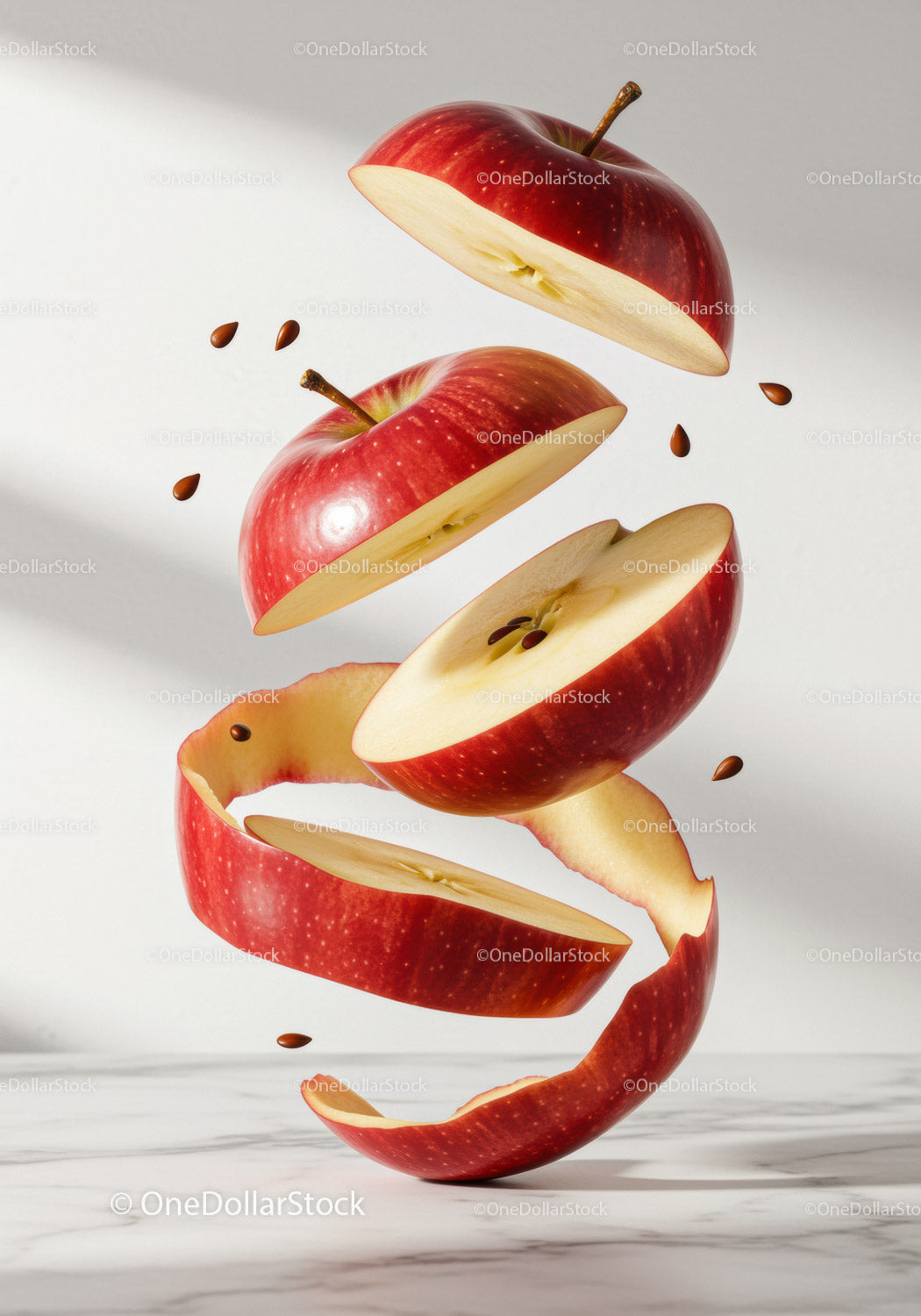 Floating sliced red apple with seeds and peel