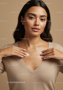 Elegant Young Woman with Flawless Skin in Neutral Beige Sweater