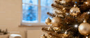 Golden Christmas Ornaments on Festive Pine Tree