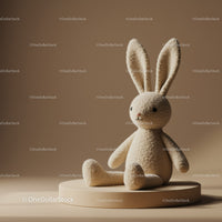 Soft beige plush bunny toy sitting on round pedestal