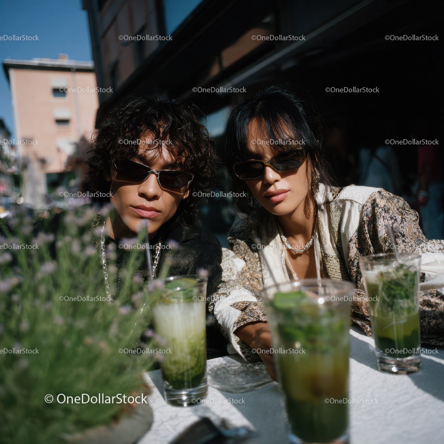 Fashionable Women Enjoying Drinks on a Sunny Outdoor Patio