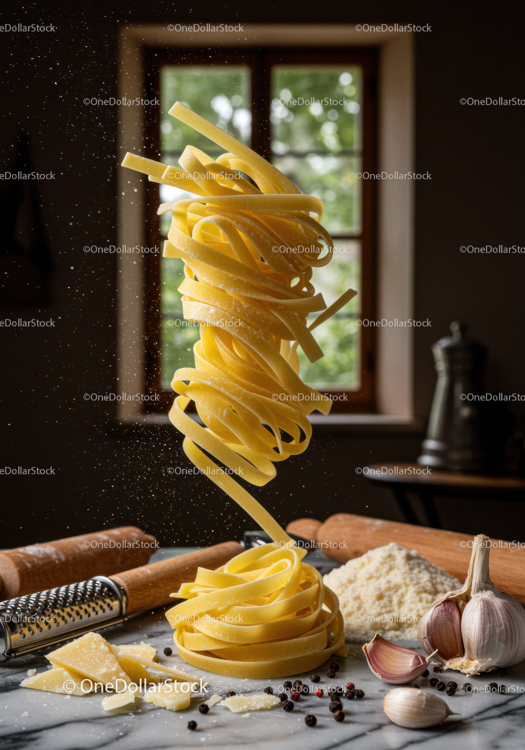 Fresh tagliatelle pasta with ingredients on kitchen table