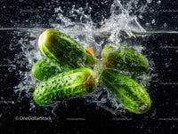 Fresh Green Cucumbers Splashing in Water with Cool Refreshing Vibe