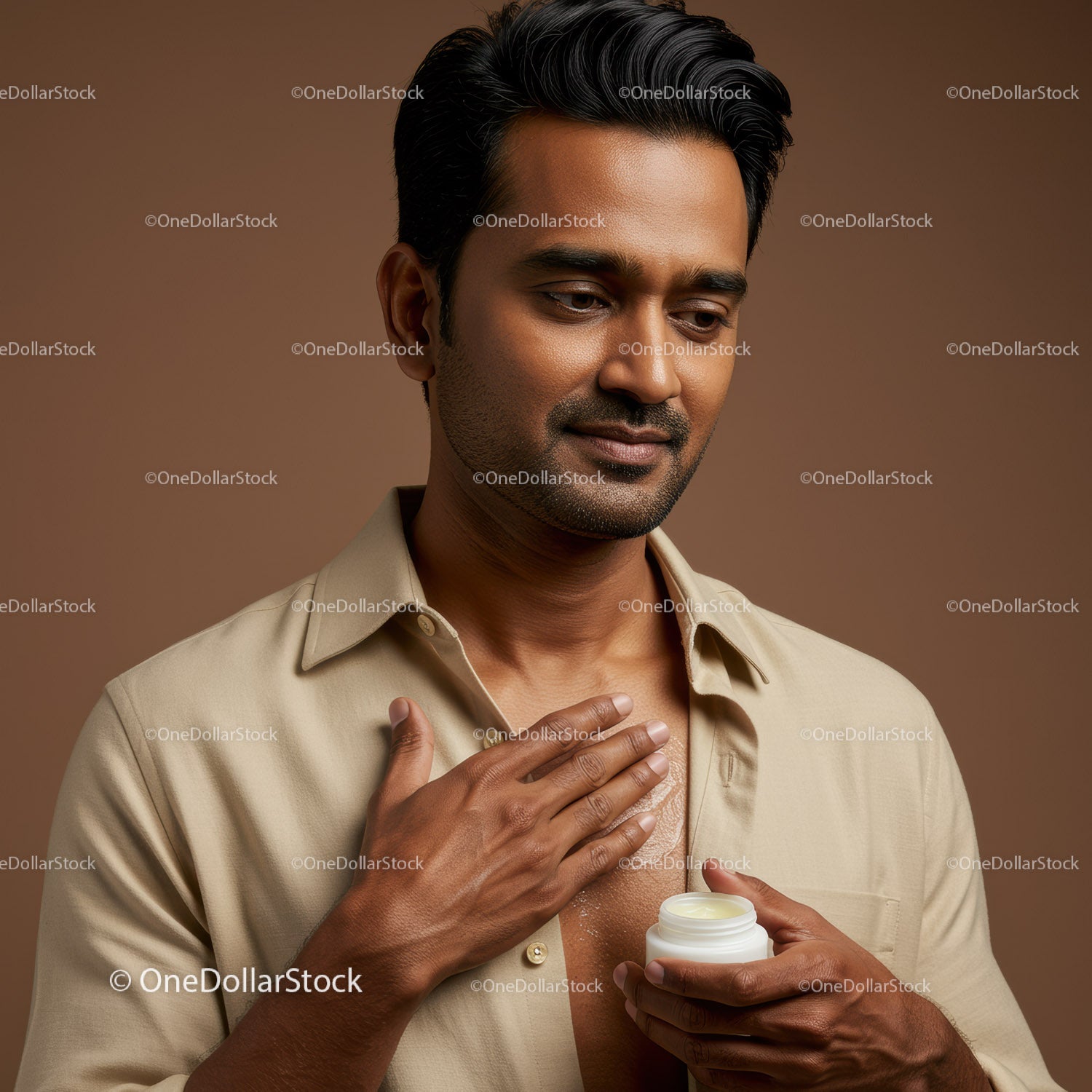 Male Applying Lotion for Skin Hydration and Grooming
