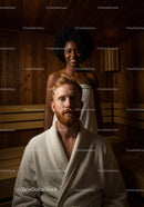 Relaxing Couple in Spa Sauna Room with Wooden Interior