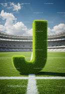 Grass letter J standing on professional soccer field