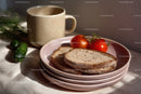 Fresh Sliced Bread with Tomatoes and Cucumber on Pink Plates