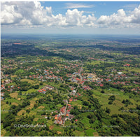 Aerial View of Rural Landscape with Houses and Green Fields