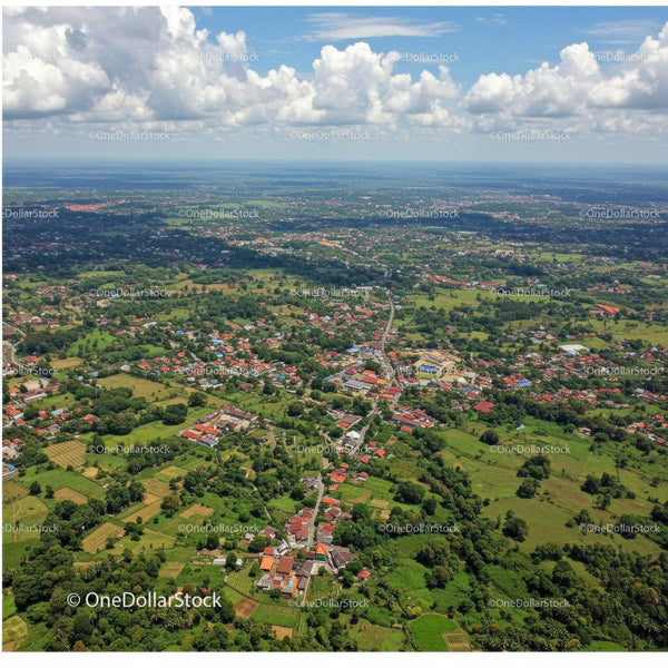 Aerial View of Rural Landscape with Houses and Green Fields