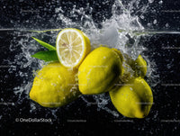 Vibrant Lemons Splashing into Water Creating Refreshing Scene