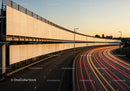 City Highway with Light Trails During Sunset in Urban Environment