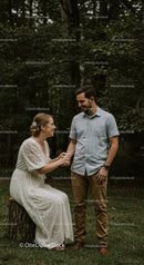 Couple sharing joyful moment in green forest setting