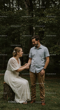 Couple sharing joyful moment in green forest setting