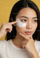 Young Woman Applying Eye Patch for Skincare Routine