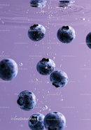 Fresh blueberries submerged in clear water bubbles