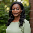 Confident woman wearing gold hoop earrings outdoors