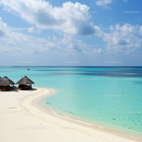 Tropical Beach with Wooden Huts and Crystal Clear Turquoise Water