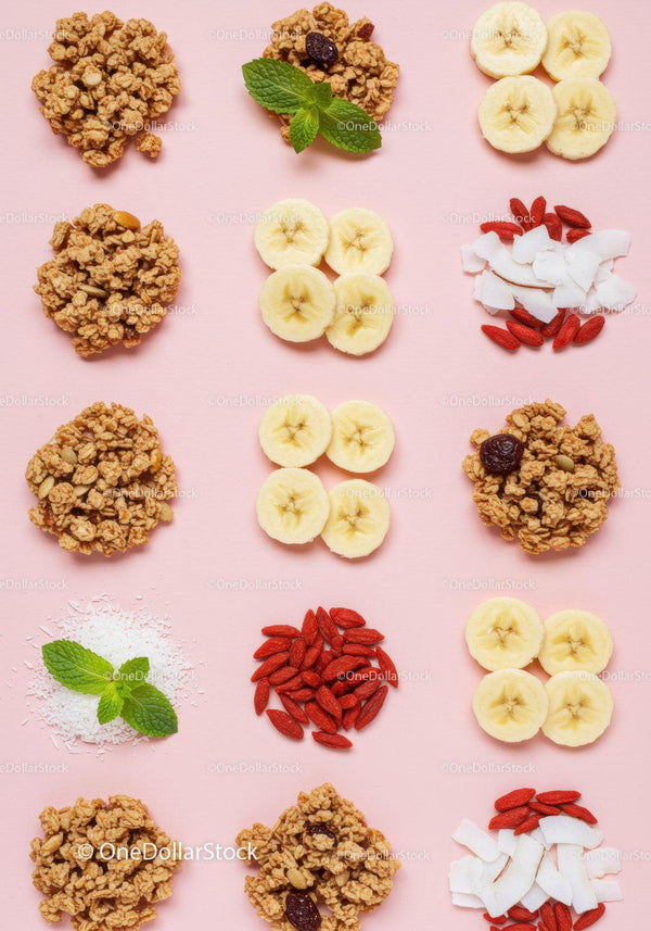 Assorted healthy granola clusters with fresh banana slices