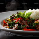 Beef Stir-Fry with Bell Peppers and Basil in a White Dish