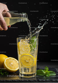 Refreshing Lemonade with Mint Splashing in Glass