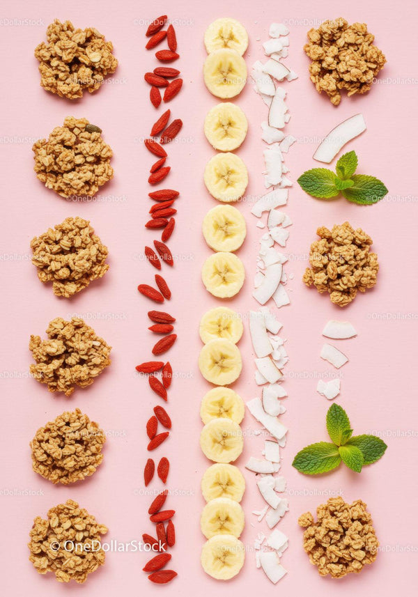 Healthy breakfast ingredients neatly arranged on pink