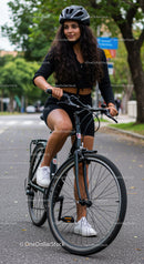 Young woman cycling outdoors in casual sportswear