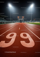 Night view of illuminated running track lanes ninety nine
