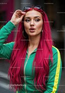 Vibrant Red Hair Woman in Green Tracksuit with Sunglasses in City