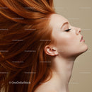 Profile of Woman with Flowing Red Hair and Calm Expression