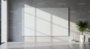 Minimalist interior with large blank canvas and green plant