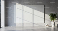 Minimalist interior with large blank canvas and green plant