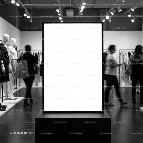 Blank advertising board in modern fashion store interior JPG Mockup Image