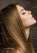 Serene woman with flawless makeup and flowing hair