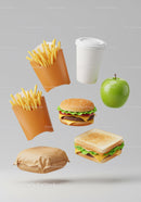 Variety of fast food items floating on light background