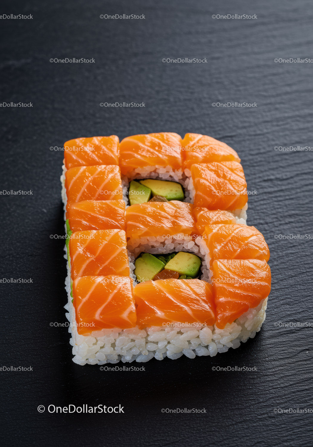 Creative sushi shaped like letter B with salmon topping