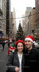 Smiling couple celebrating Christmas in city street