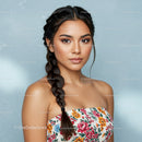 Portrait of a Young Woman Wearing a Floral Dress with Braided Hair