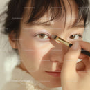 Close-up of Woman Applying Pink Eyeshadow with Brush for Beauty Makeup