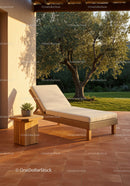 Outdoor Lounge Chair with Cushions and Green Garden Setting